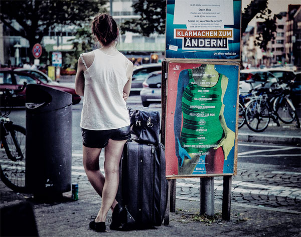 Woman with Luggage by Raul Lieberwirth